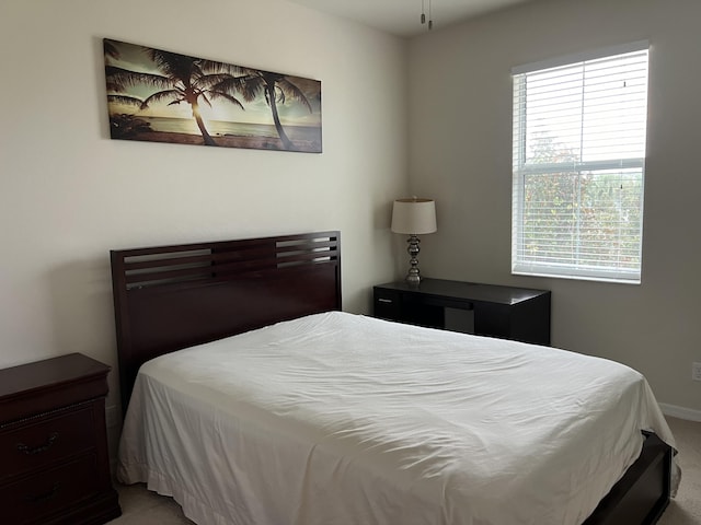 3303 E Mallory Blvd, Jupiter, FL 33458 - bedroom featuring multiple windows and carpet flooring