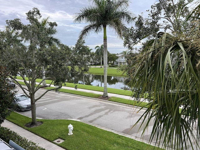 3303 E Mallory Blvd, Jupiter, FL 33458 - view of community featuring a water view and a yard