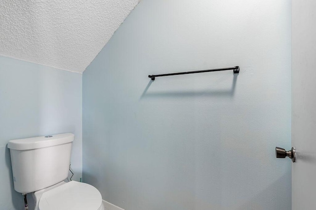 1530 Cypress Way Unit E, Palm Springs, FL 33406 - bathroom featuring toilet and a textured ceiling
