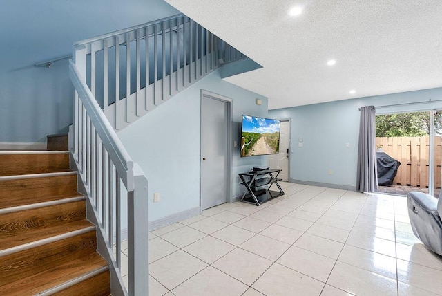 1530 Cypress Way Unit E, Palm Springs, FL 33406 - stairway featuring recessed lighting, a textured ceiling, and tile patterned floors
