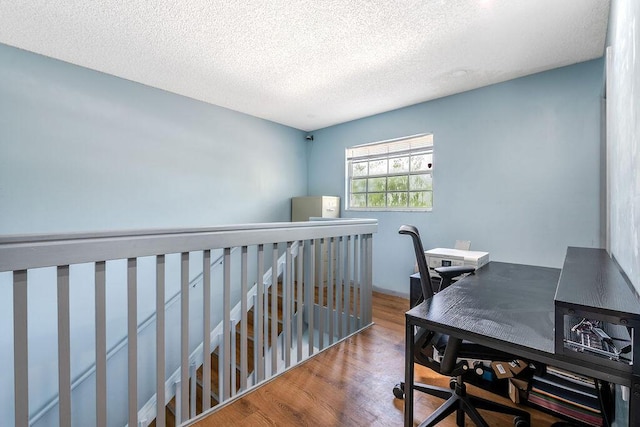 1530 Cypress Way Unit E, Palm Springs, FL 33406 - office with wood finished floors and a textured ceiling