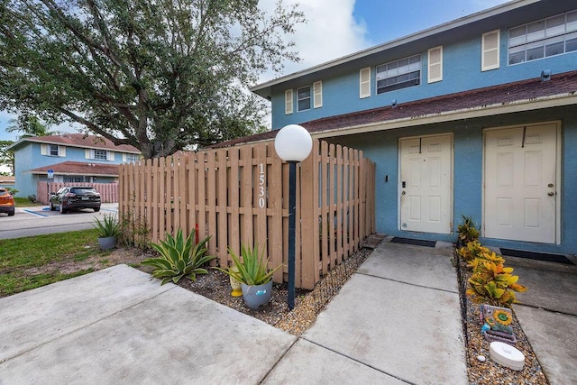 1530 Cypress Way Unit E, Palm Springs, FL 33406 - view of front facade featuring stucco siding