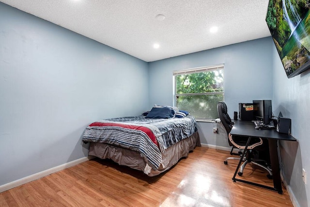 1530 Cypress Way Unit E, Palm Springs, FL 33406 - bedroom with light wood finished floors, a desk, recessed lighting, and a textured ceiling