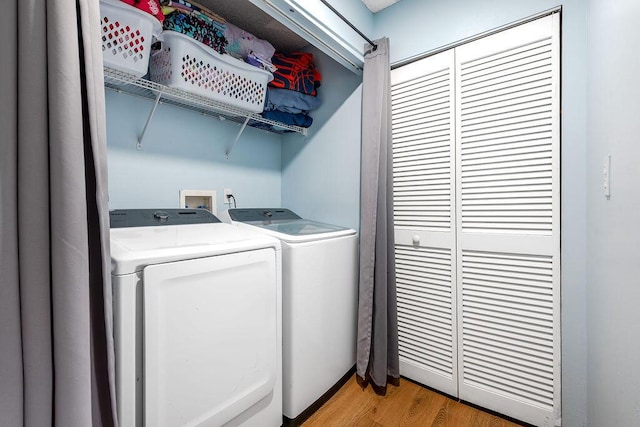 1530 Cypress Way Unit E, Palm Springs, FL 33406 - laundry area featuring separate washer and dryer and light wood-style flooring