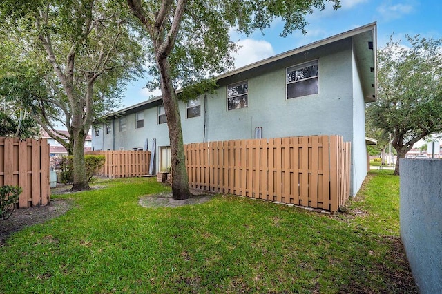 1530 Cypress Way Unit E, Palm Springs, FL 33406 - back of house with stucco siding