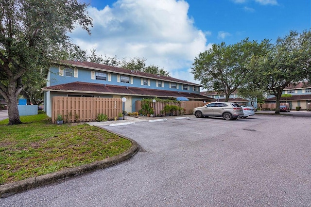 1530 Cypress Way Unit E, Palm Springs, FL 33406 - view of front of home with uncovered parking and stucco siding