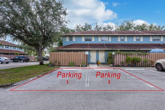 1530 Cypress Way Unit E, Palm Springs, FL 33406 - view of front of home featuring uncovered parking and stucco siding