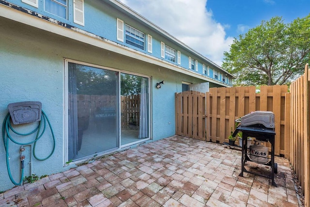 1530 Cypress Way Unit E, Palm Springs, FL 33406 - view of patio / terrace with area for grilling and a gate