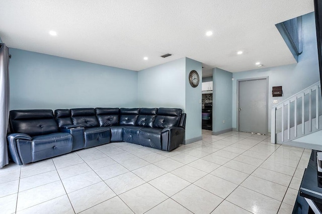 1530 Cypress Way Unit E, Palm Springs, FL 33406 - living room featuring stairs, recessed lighting, light tile patterned floors, and a textured ceiling