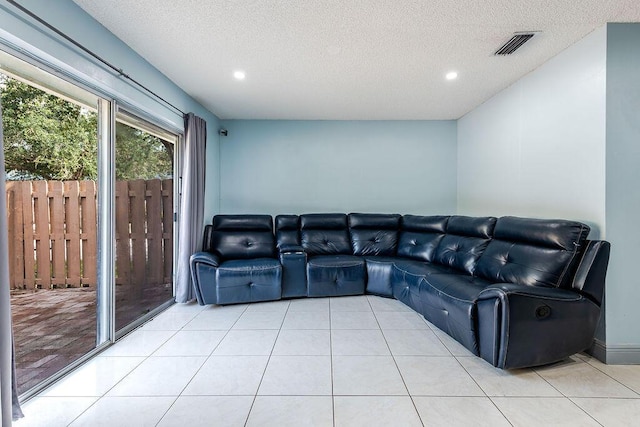 1530 Cypress Way Unit E, Palm Springs, FL 33406 - unfurnished living room with light tile patterned floors, a textured ceiling, and recessed lighting