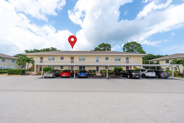 2950 SE Ocean Blvd Unit 119-6, Stuart, FL 34996 - view of building exterior with covered and uncovered parking