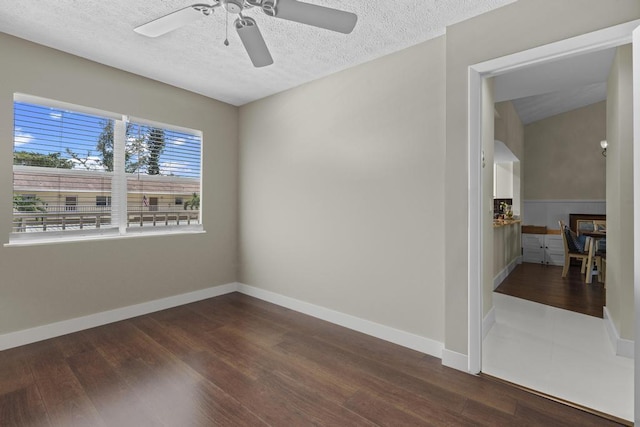 2950 SE Ocean Blvd Unit 119-6, Stuart, FL 34996 - empty room featuring dark wood finished floors, ceiling fan, and a textured ceiling