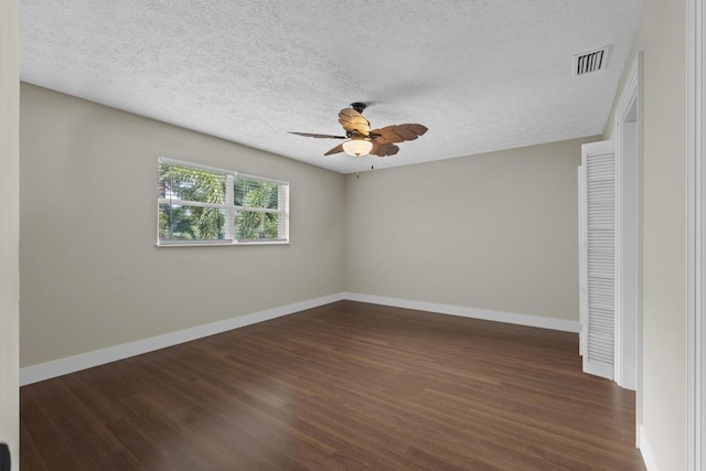 2950 SE Ocean Blvd Unit 119-6, Stuart, FL 34996 - empty room with ceiling fan, a textured ceiling, and dark wood-style floors