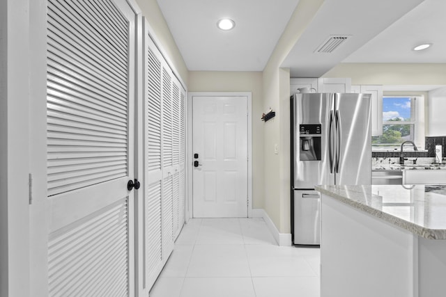 2950 SE Ocean Blvd Unit 119-6, Stuart, FL 34996 - hallway featuring light tile patterned floors and recessed lighting