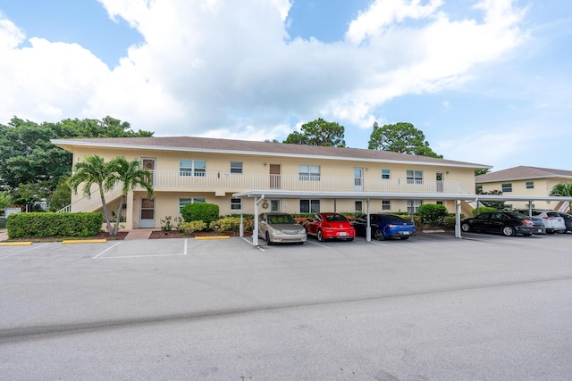 2950 SE Ocean Blvd Unit 119-6, Stuart, FL 34996 - view of property with uncovered parking
