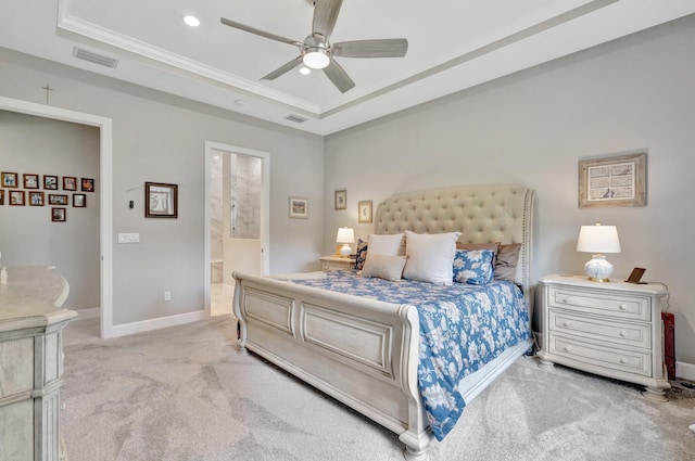 572 SE Villandry Way, Port Saint Lucie, FL 34984 - bedroom featuring a tray ceiling, light colored carpet, crown molding, ensuite bath, and recessed lighting