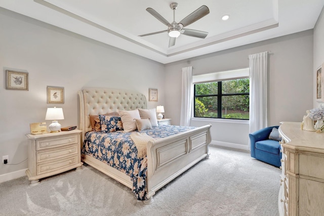 572 SE Villandry Way, Port Saint Lucie, FL 34984 - bedroom with light carpet, a tray ceiling, and ceiling fan