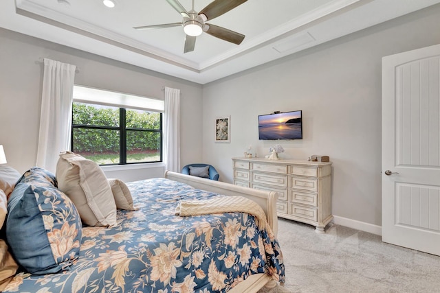 572 SE Villandry Way, Port Saint Lucie, FL 34984 - bedroom with a tray ceiling, light carpet, ornamental molding, and ceiling fan