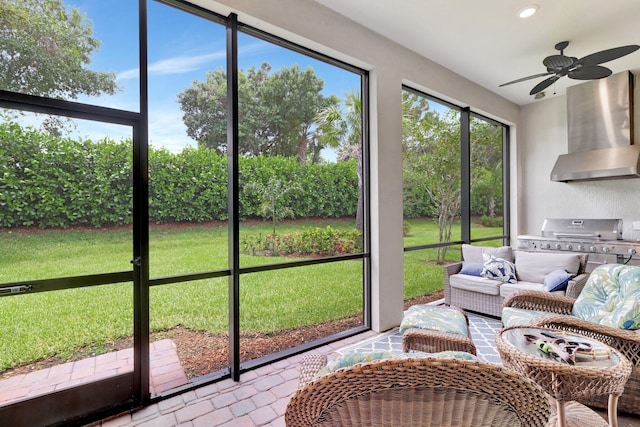 572 SE Villandry Way, Port Saint Lucie, FL 34984 - sunroom / solarium featuring a ceiling fan, outdoor lounge area, and an outdoor kitchen