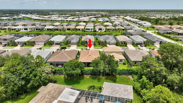 572 SE Villandry Way, Port Saint Lucie, FL 34984 - aerial perspective of suburban area with a nearby body of water