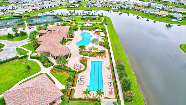 572 SE Villandry Way, Port Saint Lucie, FL 34984 - aerial perspective of suburban area with a pool area and a nearby body of water