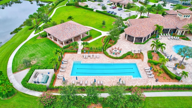 572 SE Villandry Way, Port Saint Lucie, FL 34984 - aerial view of a pool area and a large body of water
