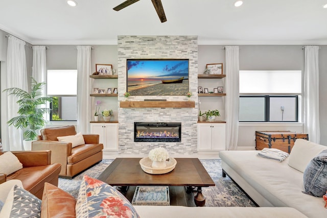 572 SE Villandry Way, Port Saint Lucie, FL 34984 - living room featuring a ceiling fan, crown molding, wood finished floors, a fireplace, and recessed lighting