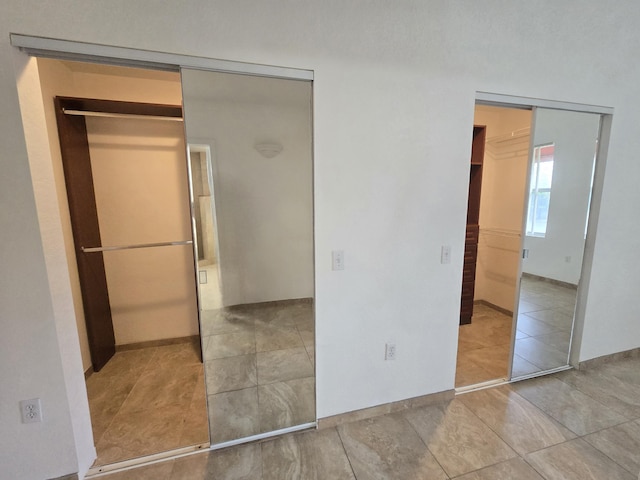 1620 Presidential Way Unit 106, West Palm Beach, FL 33401 - unfurnished bedroom featuring tile patterned floors