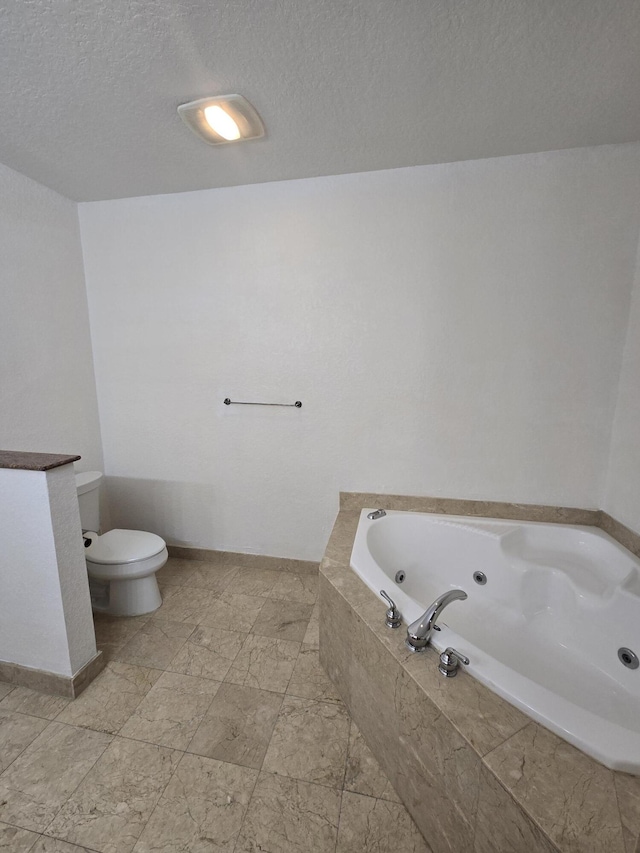 1620 Presidential Way Unit 106, West Palm Beach, FL 33401 - full bath featuring a tub with jets and a textured ceiling