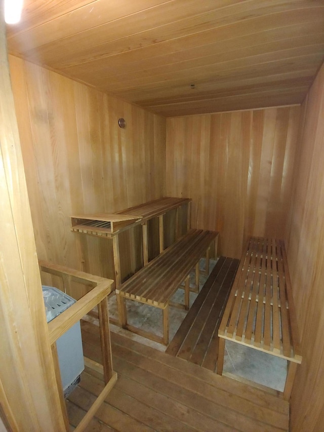 1620 Presidential Way Unit 106, West Palm Beach, FL 33401 - sauna featuring wood walls, wooden ceiling, and hardwood / wood-style floors