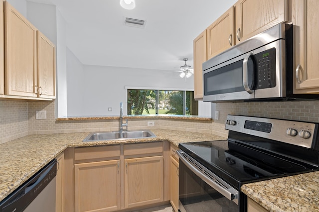 6976 Thicket Trce, Lake Worth, FL 33467 - kitchen featuring appliances with stainless steel finishes, light brown cabinets, a ceiling fan, and decorative backsplash
