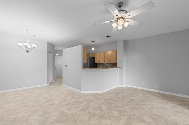 6976 Thicket Trce, Lake Worth, FL 33467 - unfurnished living room with ceiling fan and a chandelier