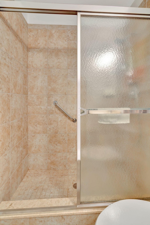 2929 SE Ocean Blvd Unit 108-4, Stuart, FL 34996 - bathroom with a stall shower and toilet