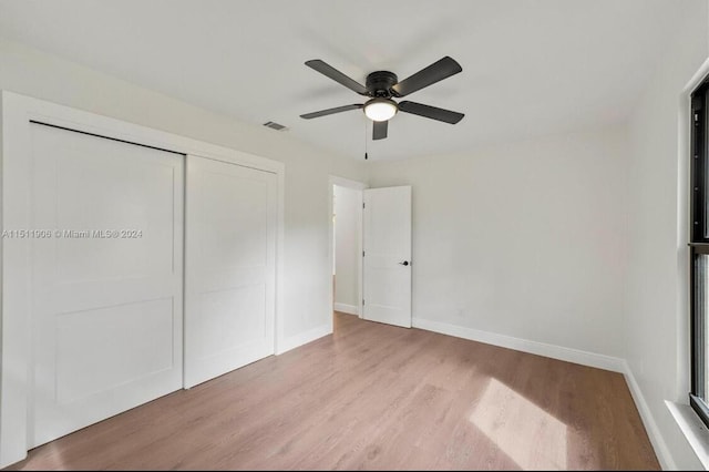 15763 Alexander Run, Jupiter, FL 33478 - unfurnished bedroom featuring wood finished floors, a closet, and ceiling fan