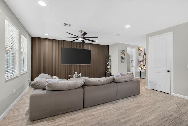 16360 Oakview Dr, Westlake, FL 33470 - living area featuring an accent wall, a ceiling fan, recessed lighting, and light wood finished floors