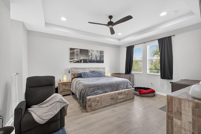 16360 Oakview Dr, Westlake, FL 33470 - bedroom featuring a raised ceiling, light wood finished floors, recessed lighting, and ceiling fan