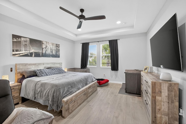 16360 Oakview Dr, Westlake, FL 33470 - bedroom with light wood-type flooring, a tray ceiling, recessed lighting, and a ceiling fan