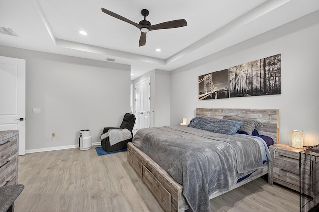 16360 Oakview Dr, Westlake, FL 33470 - bedroom featuring light wood-style flooring, recessed lighting, a raised ceiling, and ceiling fan