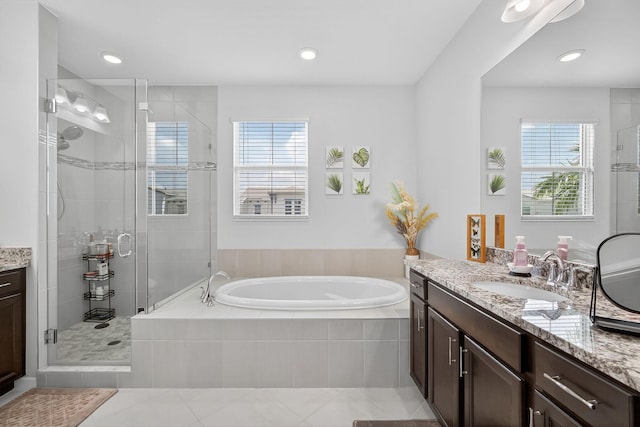 16360 Oakview Dr, Westlake, FL 33470 - full bath with vanity, a garden tub, a shower stall, tile patterned flooring, and recessed lighting