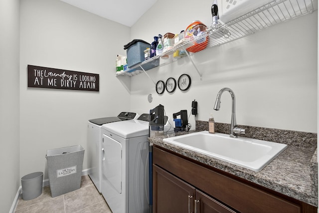 16360 Oakview Dr, Westlake, FL 33470 - laundry area featuring washing machine and dryer, cabinet space, and light tile patterned floors