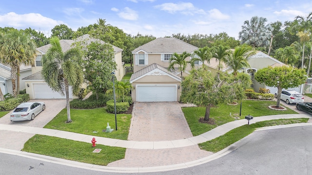 168 Canterbury Pl, Royal Palm Beach, FL 33414 - view of front facade with driveway, stucco siding, a front lawn, and a garage