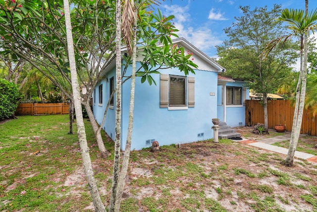 1915 Lake Ave, West Palm Beach, FL 33401 - view of front of house featuring stucco siding and crawl space