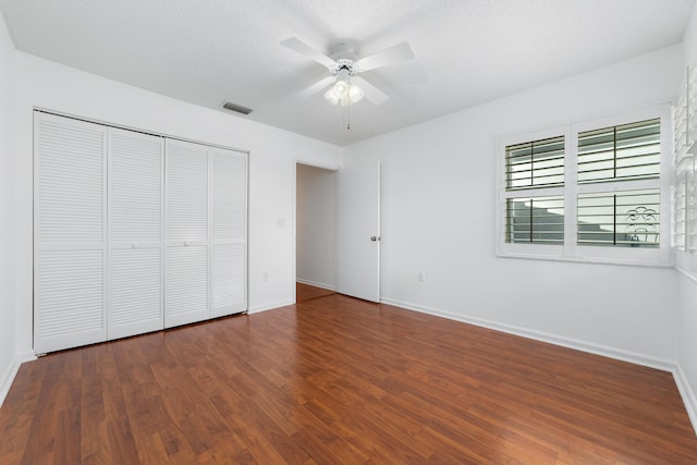 9904 Summerbrook Ter Unit C, Boynton Beach, FL 33437 - unfurnished bedroom featuring wood finished floors, a closet, and ceiling fan