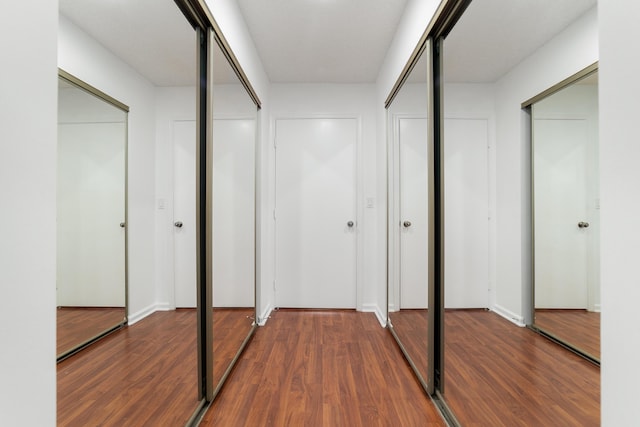 9904 Summerbrook Ter Unit C, Boynton Beach, FL 33437 - hallway featuring wood finished floors