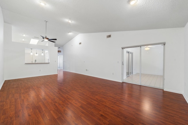 9904 Summerbrook Ter Unit C, Boynton Beach, FL 33437 - unfurnished living room with a ceiling fan, vaulted ceiling, wood finished floors, and a textured ceiling