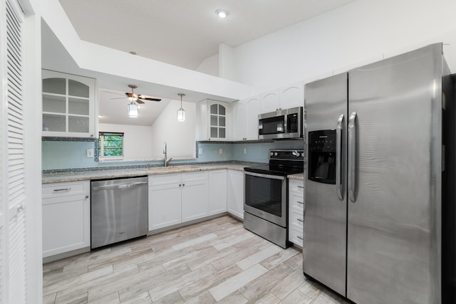 9904 Summerbrook Ter Unit C, Boynton Beach, FL 33437 - kitchen featuring appliances with stainless steel finishes, lofted ceiling, tasteful backsplash, glass insert cabinets, and ceiling fan