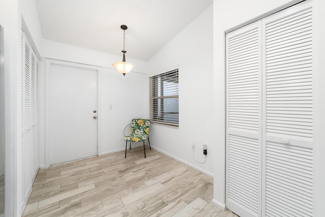 9904 Summerbrook Ter Unit C, Boynton Beach, FL 33437 - foyer entrance featuring vaulted ceiling and light wood-style flooring