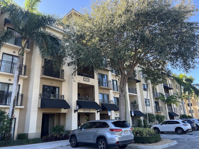 4903 Midtown Ln Unit 3120, Palm Beach Gardens, FL 33418 - view of apartment building / complex featuring uncovered parking