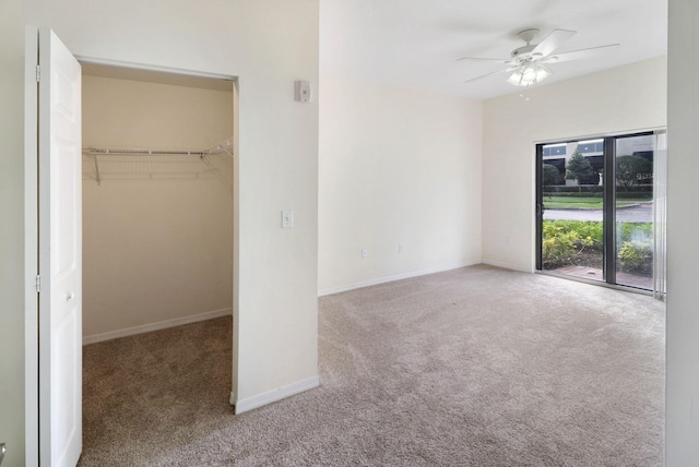 4903 Midtown Ln Unit 3120, Palm Beach Gardens, FL 33418 - unfurnished bedroom featuring carpet floors, a walk in closet, ceiling fan, and a closet