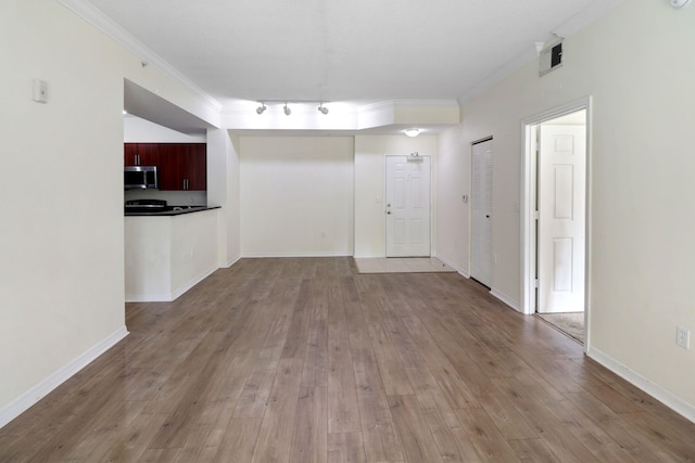 4903 Midtown Ln Unit 3120, Palm Beach Gardens, FL 33418 - unfurnished living room featuring ornamental molding, light wood-type flooring, and track lighting